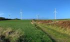 Wind turbines provide green energy on the community-owned island of Gigha