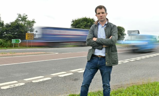 Andrew Bowie MP at the notorious Laurencekirk junction. Photography by Kath Flannery.