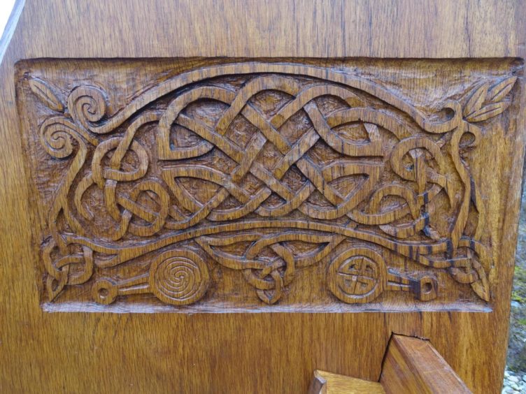 His benches are ornately decorated with carvings and sculptures