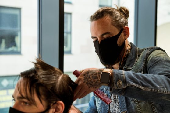 The new training school aims to train 600 barbers over the next decade.