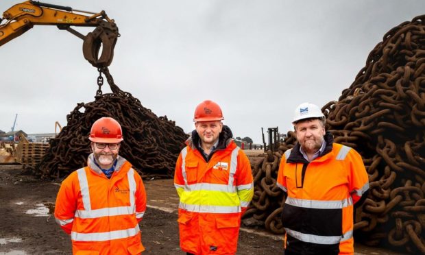 l-r Julian Foley, decommissioning and projects director, and Dave Weston, managing director, both John Lawrie Metals, and Montrose Port Authority chief executive Tom Hutchison at the site of the new decommissioning facility being built in Angus.