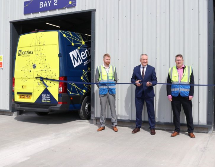 Parcels operations director Stephen Mooney, MSP Richard Lochhead and operations manager Stephen Cameron at Menzies Distribution's distribution centre in Elgin.