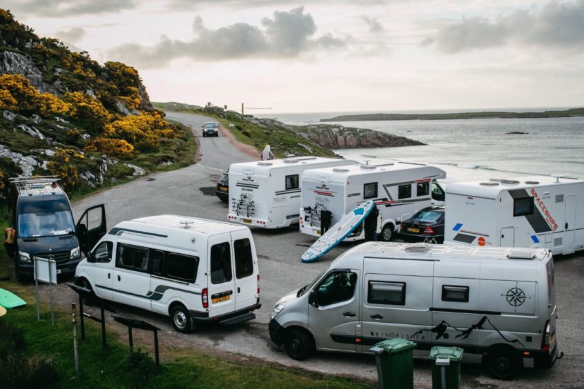 Small carparks like this one near Durness quickly fill up with motorhomes leaving no space for residents visit their local beaches.