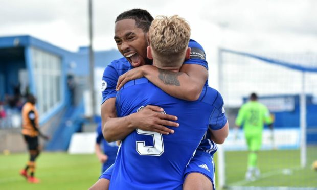 Niah Payne celebrates his goal with striker partner Russell McLean.