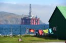 Washing on the line in Cromarty with oil rigs filling the firth. Picture by Sandy McCook
