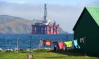 Washing on the line in Cromarty with oil rigs filling the firth. Picture by Sandy McCook