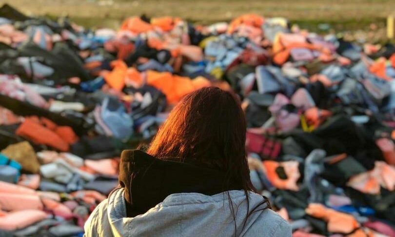 Suzanne Milne, looking over a graveyard of lifejackets at Moria Camp on the Greek island of Lesvos.