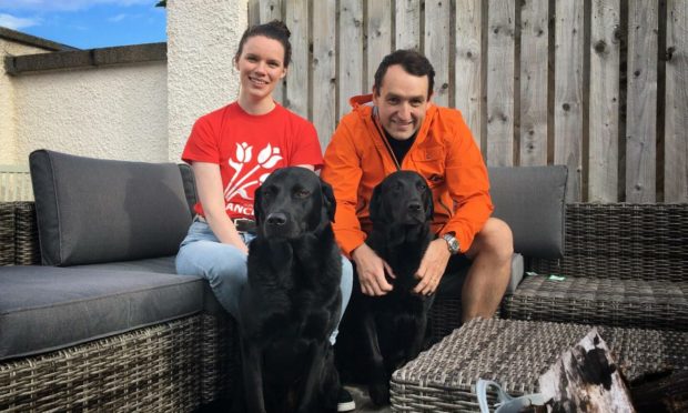 Aimee and Thomas Barter with their two dogs.