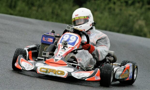 Vicki racing a kart for the first time since her teens, in 2012 in the wet.