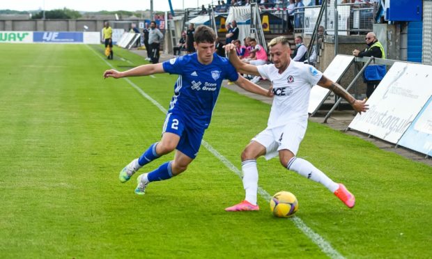 Connor Scully (right) in action for Cove Rangers.