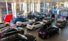 Does anyone really enjoy visiting car showrooms? (Photo: photocritical/Shutterstock)