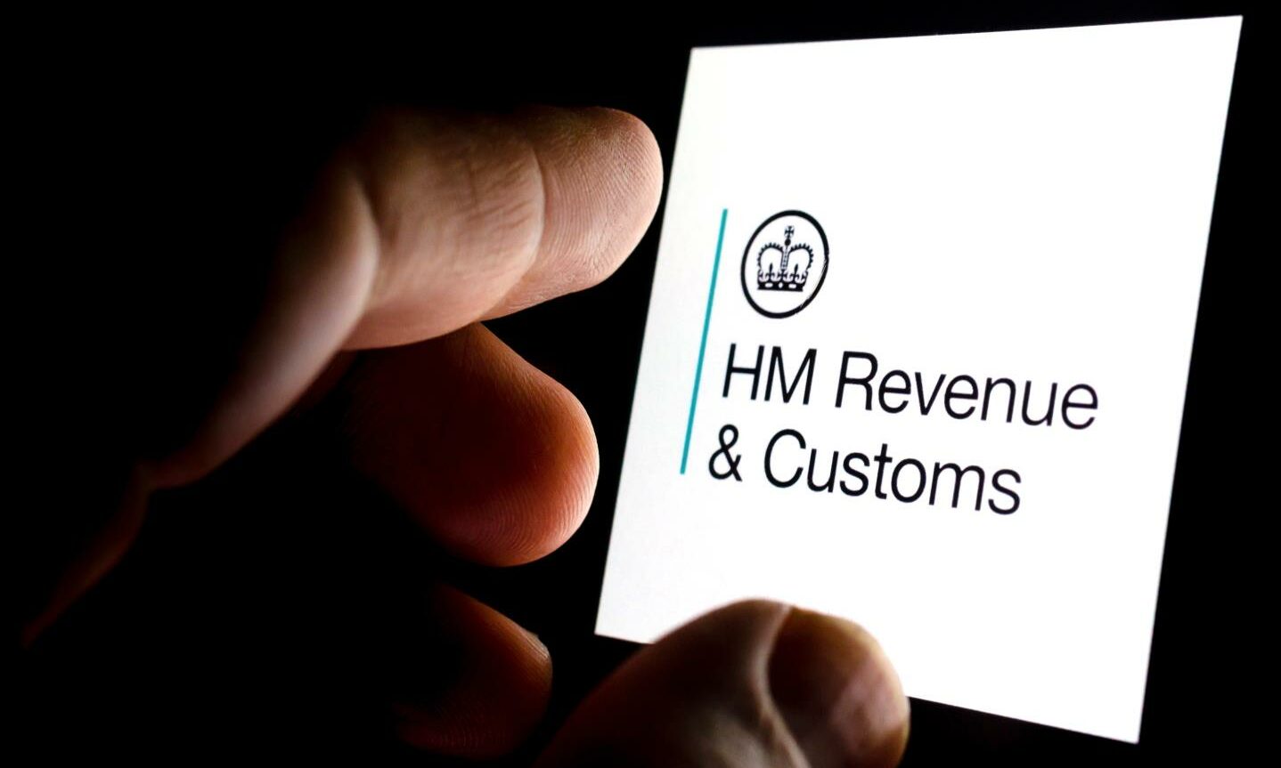 HMRC logo on phone screen. 