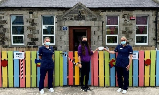 A Fraserburgh care home helped facilitate the installation of a life-saving defibrillator machine outside a local nursery. Picture shows Debbie Simpson, deputy care home manager of Meallmore's St Modans, Morgan Duncan, staff member at Playbarn Nursery and Julie-Anne Thomson, care home manager of St Modans.