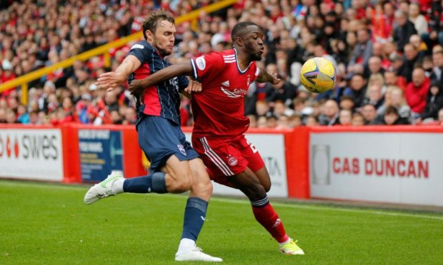 Aberdeen's Austin Samuels (23) and Ross County's  Connor Randall (2) in the 1-1 draw.