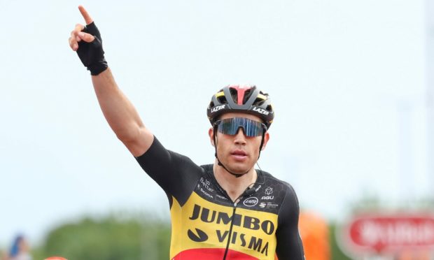 Jumbo-Visma's Wout van Aert celebrates victory on stage six of the Tour of Britain.