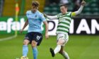Dundee's Finlay Robertson (L) and Celtic's Callum McGregor compete in the cinch Premiership.