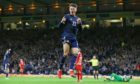 Scotland's Nathan Patterson celebrates after his shot is tapped in by Lyndon Dykes as Scotland go 1-0 up against Moldova.