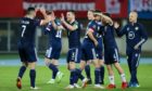 The Scotland players celebrate at full time of the 1-0 World Cup qualifier defeat of Austria.