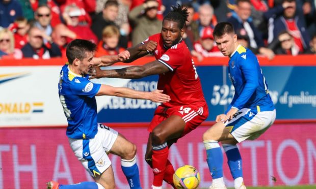 Aberdeen's Jay Emmanuel-Thomas and St Johnstone's James Brown (left) and Glenn Middleton in action.