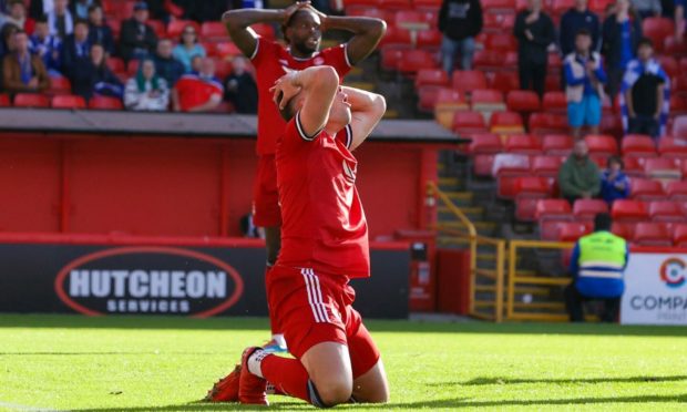 Aberdeen's Christian Ramirez holds his head after missing a chance against St Johnstone.