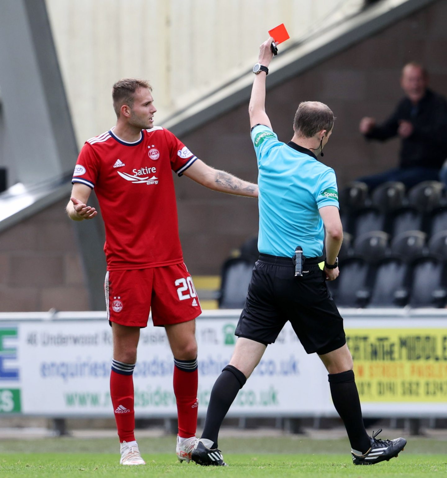Aberdeen's Teddy Jenks is shown a red card by referee Willie Collum against St Mirren.