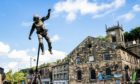 A performer from theatre company Highly Sprung Performance during their show Urban Astronaut in Holmfirth, West Yorkshire. Danny Lawson/PA Wire