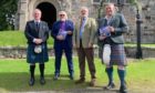 Francy Devine, John Lowrie Morrison, Rev Kenneth MacKenzie and Paul Anderson at the launch of the book about Iona, which will be presented to the Queen.