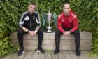 Lovat captain, Stuart MacDonald (left) and Keith MacRae, Kinlochshiel captain, sit either side of the Tulloch Homes Camanachd Cup ahead of this Saturday's 125th Anniversary final at Mossfield, Oban.