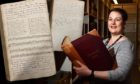 NHS Grampian archivist Fiona Musk with pages from Captain Dick's case notes.