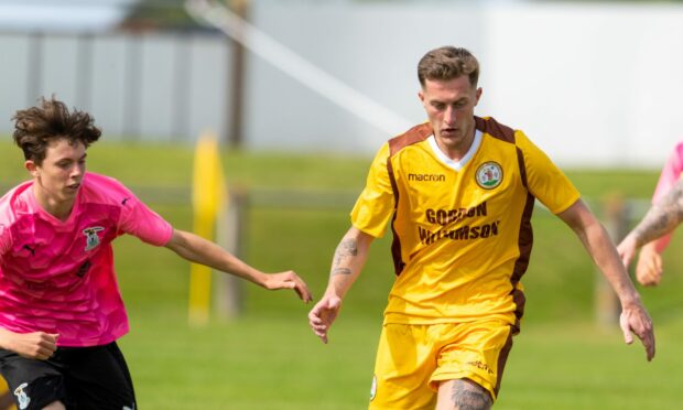 Dale Wood, right, is back playing for Forres Mechanics.