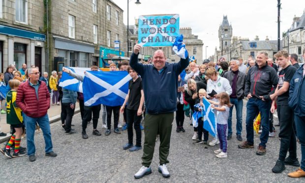 John Henderson cheered by locals as he returned home in Huntly as World Cup champion.