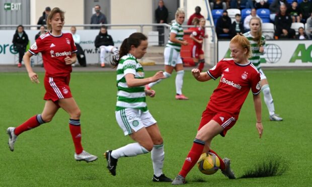 Aberdeen's Eilidh Shore (right) challenges Olivia Chance of Celtic