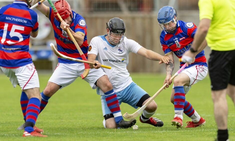 Alistair MacLeod, Skye shinty player surrounded by James Hutchison and James Falconer