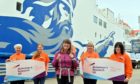 Karen Penny is pictured at the Ferry Terminal in Aberdeen heading to Shetland for the last leg of her journey with (L-R) Anne Kennedy, Alison Blaikie, Caroline Kennedy and Stacy Rowan from the charity.