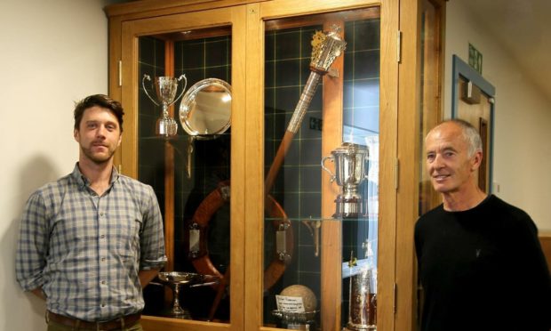 Pictured (L-R) are Lewis Lilburn and Aboyne Highland Games chairman Alistair Grant beside the new trophy cabinet.