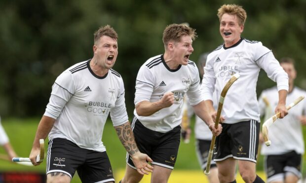 Lovat players celebrate their second goal scored by Marc MacLachlan (left).