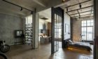 Exposed brick and flooring are features of the industrial style reminiscent of a New York loft.