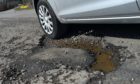 Potholes are a common complaint in the north. Picture by Kenny Elrick