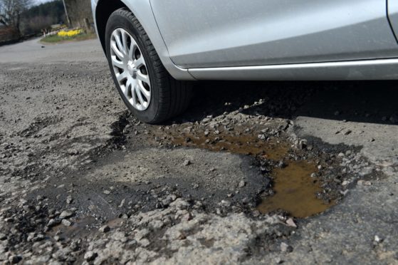 Potholes are a common complaint in the north. Picture by Kenny Elrick