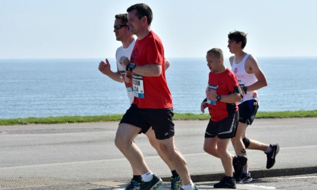Picture of Runners on Beach Esplanade. Picture by Kenny Elrick.