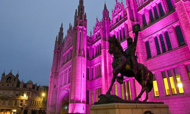 Marischal College has been illuminated pink this evening to remember six-year-old Kacey Seivwright who died at an Aberdeen after-school club.