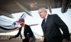 Prime Minister Boris Johnson with Dame Barbara Janet Woodward, Permanent Representative of the United Kingdom to the United Nations as he lands in New York's JFK airport for a diplomatic trip to the United States. Picture by PA.
