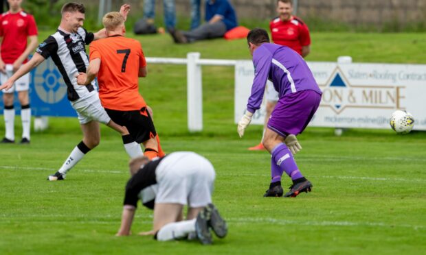 Joe Anderson, on the ground, as Rothes score against Wick on his first start for Academy