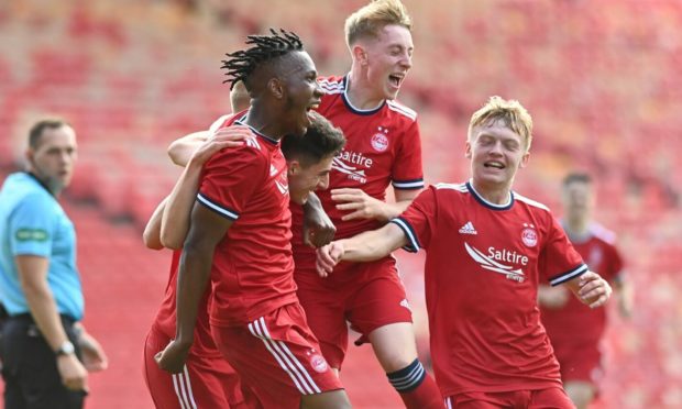 The young Dons celebrate Kevin Hanratty's winning penalty.