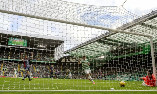 Celtic's Cameron Carter-Vickers scores the Hoops' first goal against Ross County