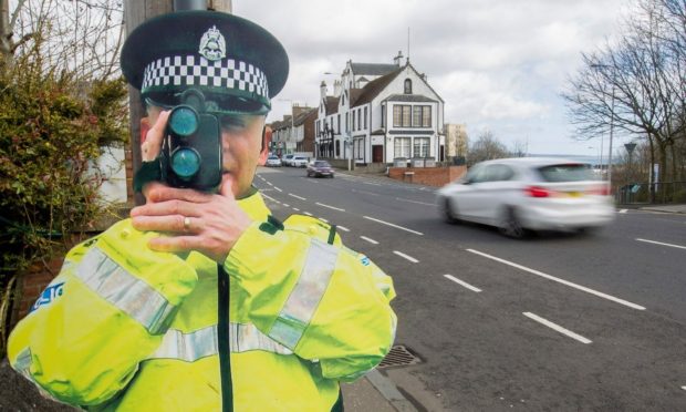 A life size cut out of a Police officer with a speed camera to help curb speeding has been stolen from a Caithness village.
