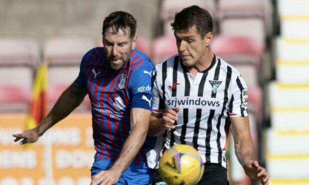 Kirk Broadfoot in action against Dunfermline's Nikolay Todorov.