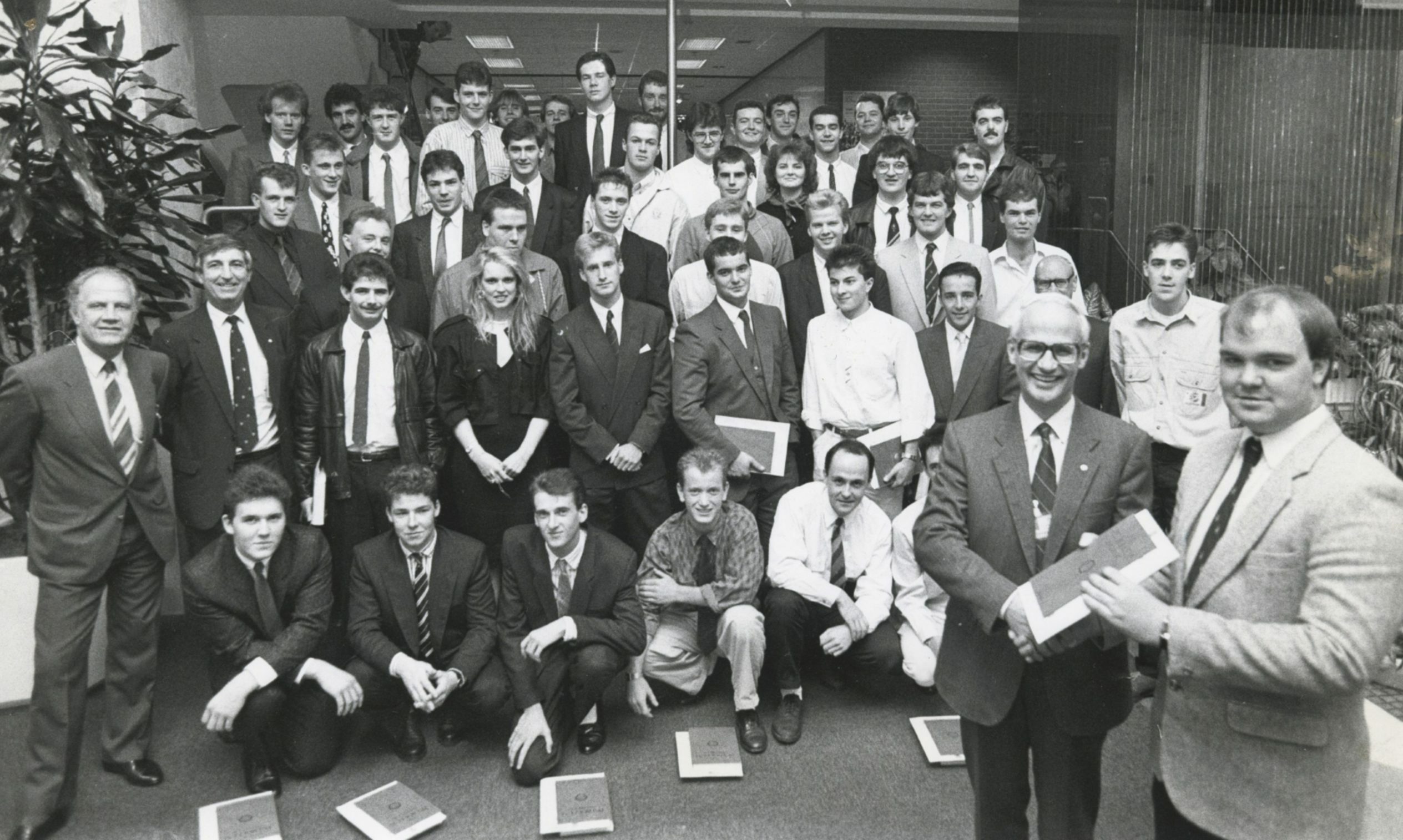 Fifty successful students from throughout Scotland and as far south as Norfolk look on as Shell Expro director of operations Ian Henderson presents Kevin Barrie, Macduff, with his Shell Expro Technician Scheme graduation certificate at Shell's Tullos HQ in 1998. 
