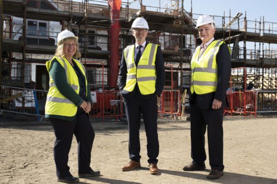 Springfield Properties chief executive, Innes Smith, centre, with chairman Sandy Adam and chief finance officer, Michelle Motion.