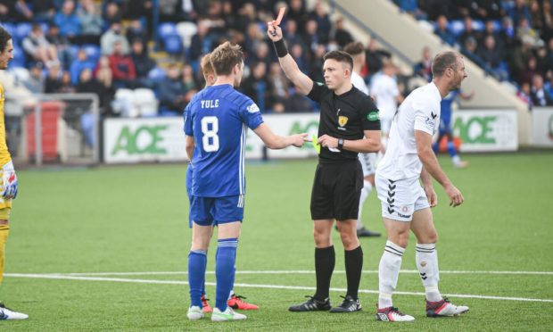 Referee Matthew MacDermid sends off Cove Rangers midfielder Blair Yule.